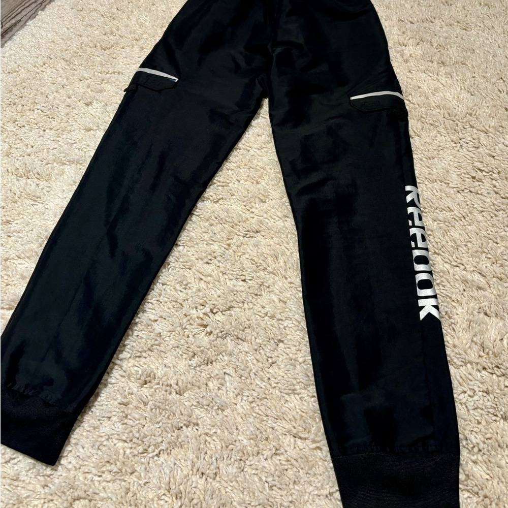 Boys black Reebok windbreaker material joggers black size L 10/12